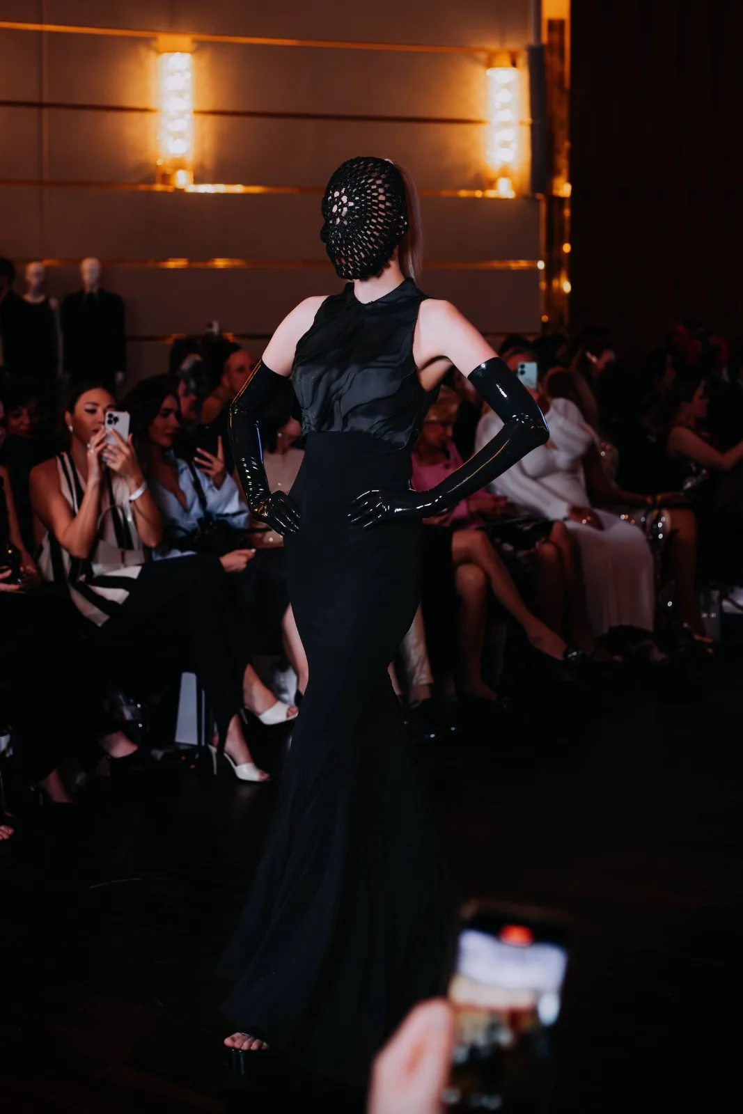 Model in a black couture gown on the Couture Fashion Night runway